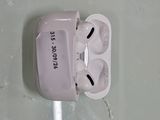 a white airpods with a charging cable attached to it