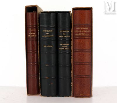 three books are lined up on top of each other on a table