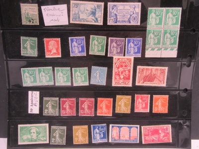 several different types of stamps are displayed on a black display case