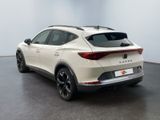 the rear end of a white suv parked in a room