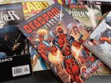 a lot of comic books on the table