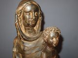 a statue of a woman holding a baby in her arms