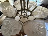 a chandelier that has a lot of glass flowers on it