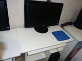 two monitors and a mouse on a white desk