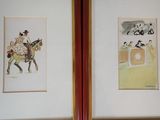 two framed pictures of a man riding a horse and a woman riding a horse