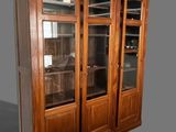 a large wooden cabinet with glass doors on it