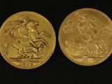 two gold coins with a picture of a man on a horse