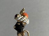 an image of a figurine of a bird with a hat on it ' s head