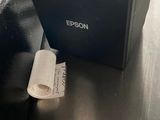 a piece of paper on the table next to a printer