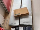 a lot of boxes on the floor next to a red door