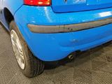 a blue car that is parked in a garage