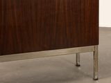 an image of a wooden cabinet with metal legs