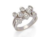 a close up of a diamond ring on a white background