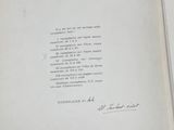 an open book with a handwritten poem on it sitting on top of a table
