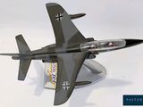 a model of a fighter jet sitting on a stand