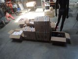 a mannequin that is standing in a room full of boxes