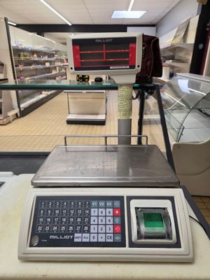 a scale that is sitting on a counter in a store