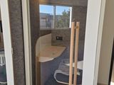 a bathroom with a toilet and a sink in it