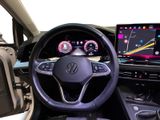 the interior of a car with a steering wheel, dashboard, and display screen
