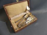 four spoons and two spoons in a case