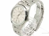 a silver watch with a white dial on a bracelet