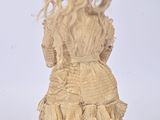 a doll that is wearing a dress and hat