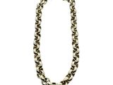 a silver chain necklace with a black and white design on it