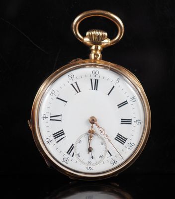 a gold pocket watch with roman numerals on it