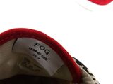 a close up of a pair of shoes with a tag on it