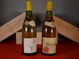 two bottles of wine sitting next to each other on a table
