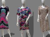 three mannequins dressed in different styles of clothing on display