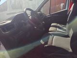 a view of the inside of a car from the driver ' s seat