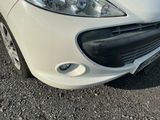 a picture of a white car parked in a parking lot