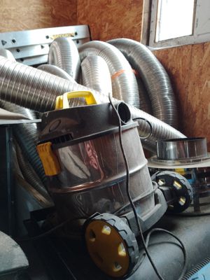 a vacuum that is sitting on top of a couch