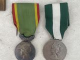 three medals and a medal on a table