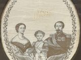 an old picture of a family portrait in a glass case