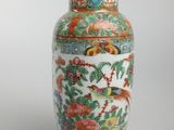 a vase that is sitting on a stand on a white surface