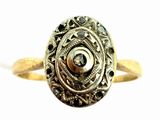 an image of a gold ring with a black diamond