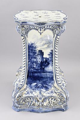 blue and white vase with a picture of a castle on it