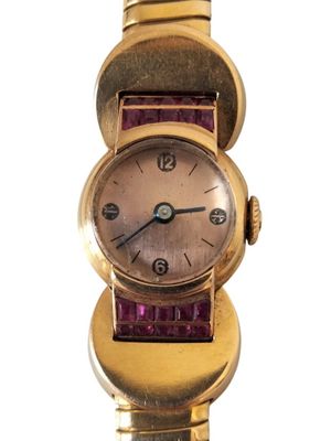 an image of a close up of a wrist watch with a purple strap