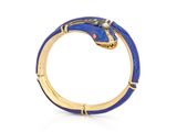 a close up of a gold ring with a blue snake on it