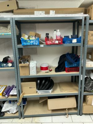 many boxes and boxes on the shelves in the room