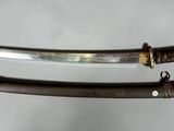 two swords are displayed on a white surface with a white background