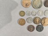 a lot of coins that are on the table