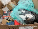 a cardboard box filled with assorted items in a store