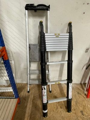 two ladders that are next to each other in a room