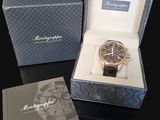 a box with a watch inside of it on a table