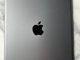 an apple ipad sitting on top of a marble table next to a cup of coffee