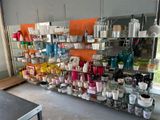a shelf with many different items on it in a room