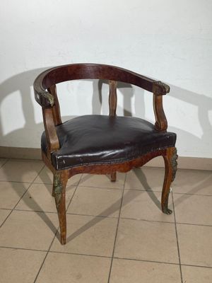 a chair that is sitting in a room with tile flooring